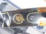 8796 Beretta Black & Gold Tercentennial Model, 12 gauge, 28 inch barrel, M/F chokes, gold trigger, 14 1/4 LOP.
#10 of 300, exquisite high luster blac - 15 of 25