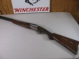 8804
Winchester 23 Pigeon XTR, 12 Gauge, 26” Barrels, IC/Mod, vent rib, ejectors, rose and scroll engraved, coin finish, 14” LOP, Winchester butt pla
