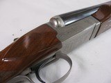 8804Winchester 23 Pigeon XTR, 12 Gauge, 26” Barrels, IC/Mod, vent rib, ejectors, rose and scroll engraved, coin finish, 14” LOP, Winchester butt pla - 14 of 16