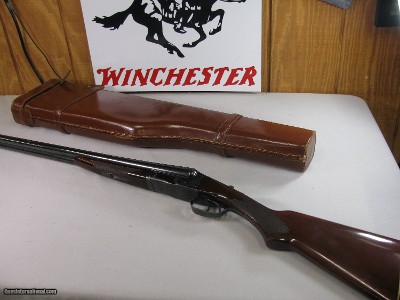 8809
Winchester Model 21 12 Gauge, 26” reblued barrel, SK/SK, After Market engraved receiver, splinter forend, double trigger, ejectors, 2 white bead