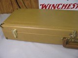8813
Winchester yellow Naugahyde case, 99% condition, brass plate engraved Winchester, combination locks, will take up to 32” barrels - 3 of 8
