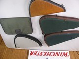 8815
5 pistol soft cases, 2 Allen green 14” Pistol cases, Brown Leather Pistol case 11”, Gray pistol case 12”, Green Pad case 11” All are good used c