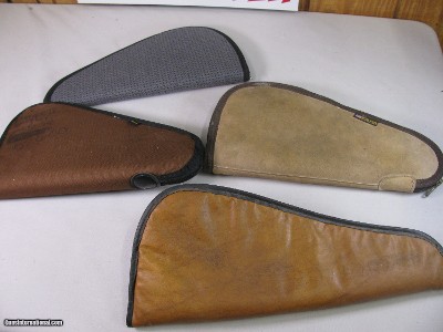 8816
4 Pistol soft cases, Kolpin 14 1/2”, Allen 14”, Brown leather Pistol case 16 1/2”, Moose pistol case 15”. All are good used condition.