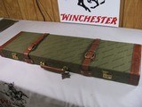 8831
Winchester Grand European Shotgun case. These are very rare to come by. This case will fit up to a 32” Barrel. It has the original hang , keys a - 12 of 12