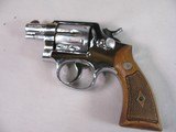 8861 Smith and Wesson Model 36, 38 Special, 2” Barrel, Nickel Finish, wood Grips, Minor marks on the cylinder what looks like from sitting in a gun ba - 2 of 11