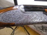 8847
Rizzini Regal EM, 16 Gauge, Screw in Chokes, 5 Chokes included in choke box and wrench, Round Knob, 29” Barrels, Highly Engraved Coin receiver, - 12 of 19