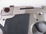 8865
Smith and Wesson Model 469, 9MM, 3.5” barrel, Silver satin nickel, black grips, bore is bright and shiny, original magazine. 98% condition - 9 of 14