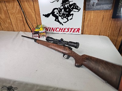 8873
Winchester Model 70 Super Grade, 257 Roberts, Very rare one of only 500 Cabela’s Edition, Sling Studs, Ebony tip, Wood Stock, 98%. Zeiss Conques