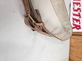 8884
Hand tooled leather holster, 38-40 “ waist, Lined with suede, will take a 10” Barrel. Darker brown leather. - 2 of 9