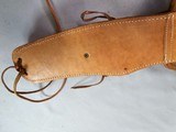 8885
Hand tooled leather Holster, 32 to 34 waist, made in Mexico, will take a 8 1/2 barrel. Light leather - 6 of 8