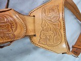 8885
Hand tooled leather Holster, 32 to 34 waist, made in Mexico, will take a 8 1/2 barrel. Light leather - 3 of 8