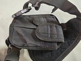 8919
Shoulder Harness black canvas, New. Conceal carry pistol with 2 mag holders. Adjustable. - 3 of 5