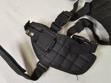 8919
Shoulder Harness black canvas, New. Conceal carry pistol with 2 mag holders. Adjustable. - 2 of 5