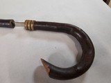 8939- Sword Cane- This antique can sword has AA polish Toledo Spanish metal, 1900 is marked on it as well. Had a crooked handle and a bamboo sheath fo - 2 of 17