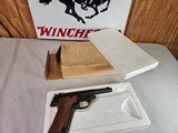 8983 High Standard Sport King, 22 LR, 4 1/2 barrel, NIB, wood grips, More pictures at dawsonsdoubles.com