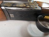 9013
SKB-Ithaca, 280, 20 Gauge, SXS, 25” barrels, Mod/Imp, straight grip, Ithaca-SKB butt plate, Gold Accent, in scroll work, single gold trigger, 97 - 6 of 23