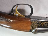 9013
SKB-Ithaca, 280, 20 Gauge, SXS, 25” barrels, Mod/Imp, straight grip, Ithaca-SKB butt plate, Gold Accent, in scroll work, single gold trigger, 97 - 4 of 23