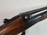 9015
SKB-Ithaca 280 Classic 12 Gauge SXS, 2 3/4, 26” Barrels, straight stock, SKB/Ithaca butt plate, 99% LNIB, 14 1/4 LOP, Single gold trigger, MOD/ - 22 of 25