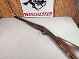 9015
SKB-Ithaca 280 Classic 12 Gauge SXS, 2 3/4, 26” Barrels, straight stock, SKB/Ithaca butt plate, 99% LNIB, 14 1/4 LOP, Single gold trigger, MOD/ - 1 of 25