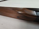 9015
SKB-Ithaca 280 Classic 12 Gauge SXS, 2 3/4, 26” Barrels, straight stock, SKB/Ithaca butt plate, 99% LNIB, 14 1/4 LOP, Single gold trigger, MOD/ - 9 of 25