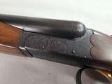 9015
SKB-Ithaca 280 Classic 12 Gauge SXS, 2 3/4, 26” Barrels, straight stock, SKB/Ithaca butt plate, 99% LNIB, 14 1/4 LOP, Single gold trigger, MOD/ - 7 of 25