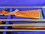 9017 Winchester 101
3 barrel skeet set, 20 gauge, 28 gauge, 410 gauge, pistol grip, vent rib, 13 1/2 LOP, 28” barrels, In correct case, 97%, great sk - 3 of 25