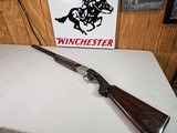 9029
Winchester 101 Pigeon Grade, 20 Gauge, 26” barrels, 2 3/4 and 3”, Early good one, with dark tiger stripped walnut, round knob, 98%, butt plate, - 1 of 21