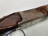 9029
Winchester 101 Pigeon Grade, 20 Gauge, 26” barrels, 2 3/4 and 3”, Early good one, with dark tiger stripped walnut, round knob, 98%, butt plate, - 19 of 21