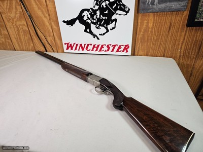 9029
Winchester 101 Pigeon Grade, 20 Gauge, 26” barrels, 2 3/4 and 3”, Early good one, with dark tiger stripped walnut, round knob, 98%, butt plate,
