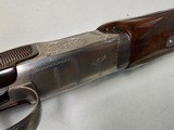 9029
Winchester 101 Pigeon Grade, 20 Gauge, 26” barrels, 2 3/4 and 3”, Early good one, with dark tiger stripped walnut, round knob, 98%, butt plate, - 18 of 21