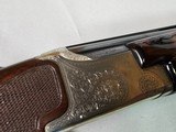 9038
Winchester 101 Pigeon 20 Gauge. Pistol Grip, 2 3/4 and 3”, Vent Rib, 28” Barrels, Full/MOD, Ejectors, LOP 14 1/4, Winchester butt plate, 96-97% - 23 of 25