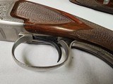 9037
Winchester 101 Pigeon Grade, 20 Gauge, 2 3/4, 26” vent rib barrels, IC/MOD, 14 1/4 LOP, Round Knob, Butt plate, Beautiful dark walnut, 99%, Corr - 7 of 25