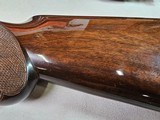 9037
Winchester 101 Pigeon Grade, 20 Gauge, 2 3/4, 26” vent rib barrels, IC/MOD, 14 1/4 LOP, Round Knob, Butt plate, Beautiful dark walnut, 99%, Corr - 4 of 25