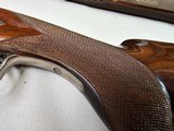 9037
Winchester 101 Pigeon Grade, 20 Gauge, 2 3/4, 26” vent rib barrels, IC/MOD, 14 1/4 LOP, Round Knob, Butt plate, Beautiful dark walnut, 99%, Corr - 6 of 25