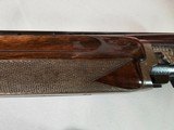 9039
Winchester 101 Pigeon Grade, 12 Gauge, 2 3/4, 28” vent rib barrels, MOD/Full, 14 1/4 LOP, Round Knob, Butt plate, Beautiful dark walnut, 99%, Co - 18 of 25