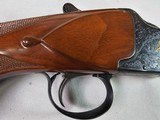 9036
Winchester Grand European Presentation Grade, Pistol Grip, Single selective trigger, 12 Gauge, SK/SK, 27” barrels, Ejectors, AA++ Walnut, 14 1/4 - 12 of 25