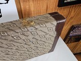 9053 Winchester Diamond Grade hard trunk style case. VERY rare as it will hold up to
34” barrel. Not many in this size. Has the original keys as well - 8 of 18