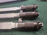 9056 Yugoslavian SKS blade bayonet, New. There are three in this lot, they have a 11” blade and lug for the rifle mount. More pictures at dawsonsdoubl - 10 of 14