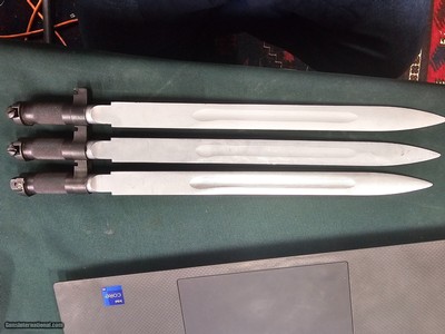 9056 Yugoslavian SKS blade bayonet, New. There are three in this lot, they have a 11” blade and lug for the rifle mount. More pictures at dawsonsdoubl