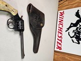 9054 H+R Arms Model 922 22 Caliber Long Rifle, Blued, 9 round, plastic checkered grips, 6” barre;, Leather custom holster. More pictures at dawsonsdou - 1 of 21