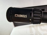 9062
Steiner T5XI 5-25x56, Steiner SCR Reticle,34 MM tube, matte black, # 5122, like new in box,
More pictures at dawsonsdoubles.com - 4 of 15