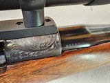 9063
Neumann Liege Belgium, 7x57, Mannlicher stock with check piece, heavy German engraving, engraved buffalo on floor plate, Flor des lies, ebony fr - 22 of 25