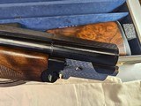 9065
Beretta 692, 12 gauge, 30” barrels, 6 chokes (2 Skeet, IC, M, IM, LM, CL) cleaning rod, 2 snap caps, Beretta ASE AAA fancy walnut, vent rib, but - 21 of 25