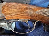 9065
Beretta 692, 12 gauge, 30” barrels, 6 chokes (2 Skeet, IC, M, IM, LM, CL) cleaning rod, 2 snap caps, Beretta ASE AAA fancy walnut, vent rib, but - 5 of 25