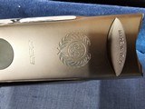 9065
Beretta 692, 12 gauge, 30” barrels, 6 chokes (2 Skeet, IC, M, IM, LM, CL) cleaning rod, 2 snap caps, Beretta ASE AAA fancy walnut, vent rib, but - 7 of 25