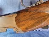 9065
Beretta 692, 12 gauge, 30” barrels, 6 chokes (2 Skeet, IC, M, IM, LM, CL) cleaning rod, 2 snap caps, Beretta ASE AAA fancy walnut, vent rib, but - 10 of 25
