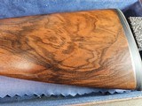 9065
Beretta 692, 12 gauge, 30” barrels, 6 chokes (2 Skeet, IC, M, IM, LM, CL) cleaning rod, 2 snap caps, Beretta ASE AAA fancy walnut, vent rib, but - 2 of 25