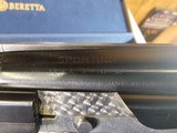 9065
Beretta 692, 12 gauge, 30” barrels, 6 chokes (2 Skeet, IC, M, IM, LM, CL) cleaning rod, 2 snap caps, Beretta ASE AAA fancy walnut, vent rib, but - 20 of 25