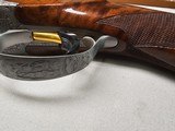 9067
Browning FN Superposed Diana Grade!!
SUPER RARE..
By R Kowalski Master Engraver, signed on BOTH Sides, Made in 1969, 2 3/4 chambers, 30” venti - 12 of 25