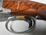 9067
Browning FN Superposed Diana Grade!!
SUPER RARE..
By R Kowalski Master Engraver, signed on BOTH Sides, Made in 1969, 2 3/4 chambers, 30” venti - 7 of 25